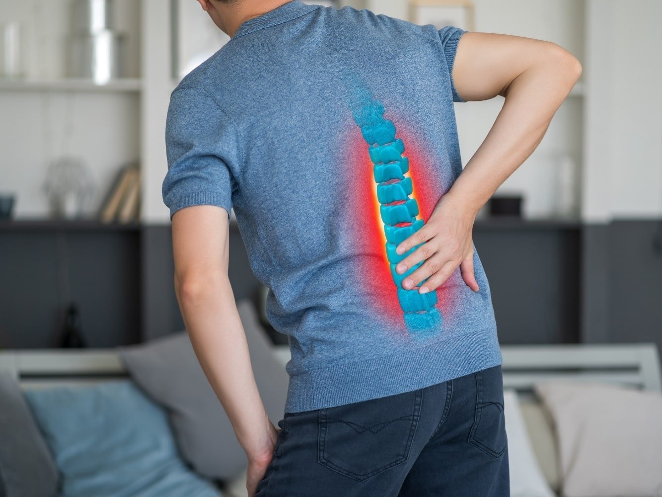 man in pain due to herniated disc back